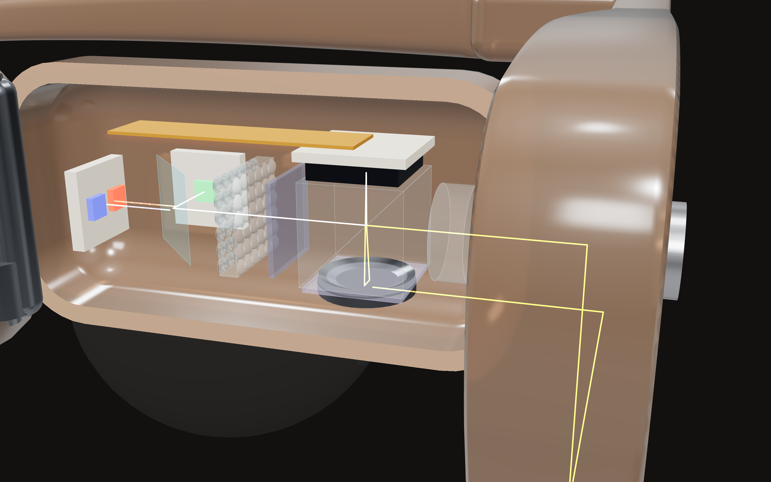 The projector inside the opened right temple. The yellow lines sketch the light path.